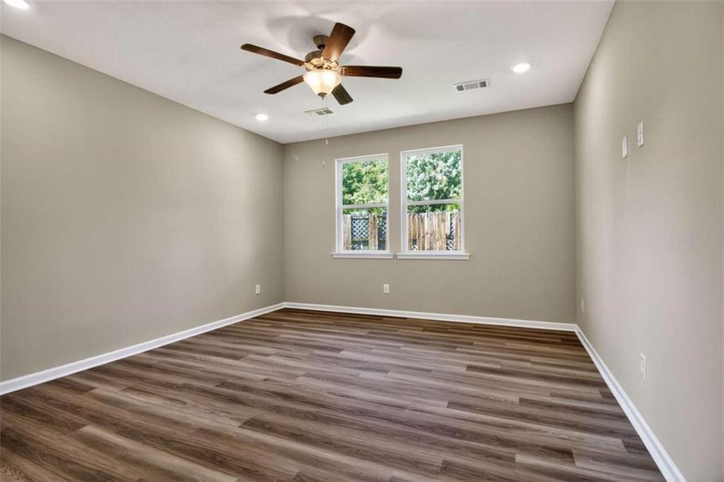 103 Gnome Court Perry, GA 31069 - Photo 29 of 30 an empty room with wooden floor and windows