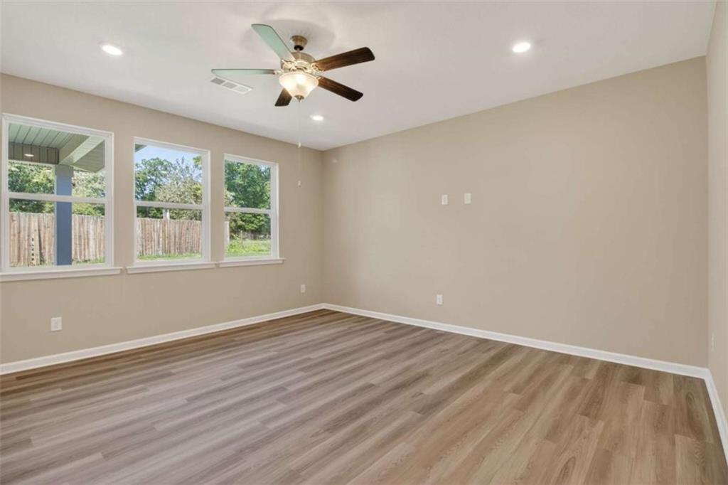 103 Gnome Court Perry, GA 31069 - Photo 30 of 30 an empty room with wooden floor and windows