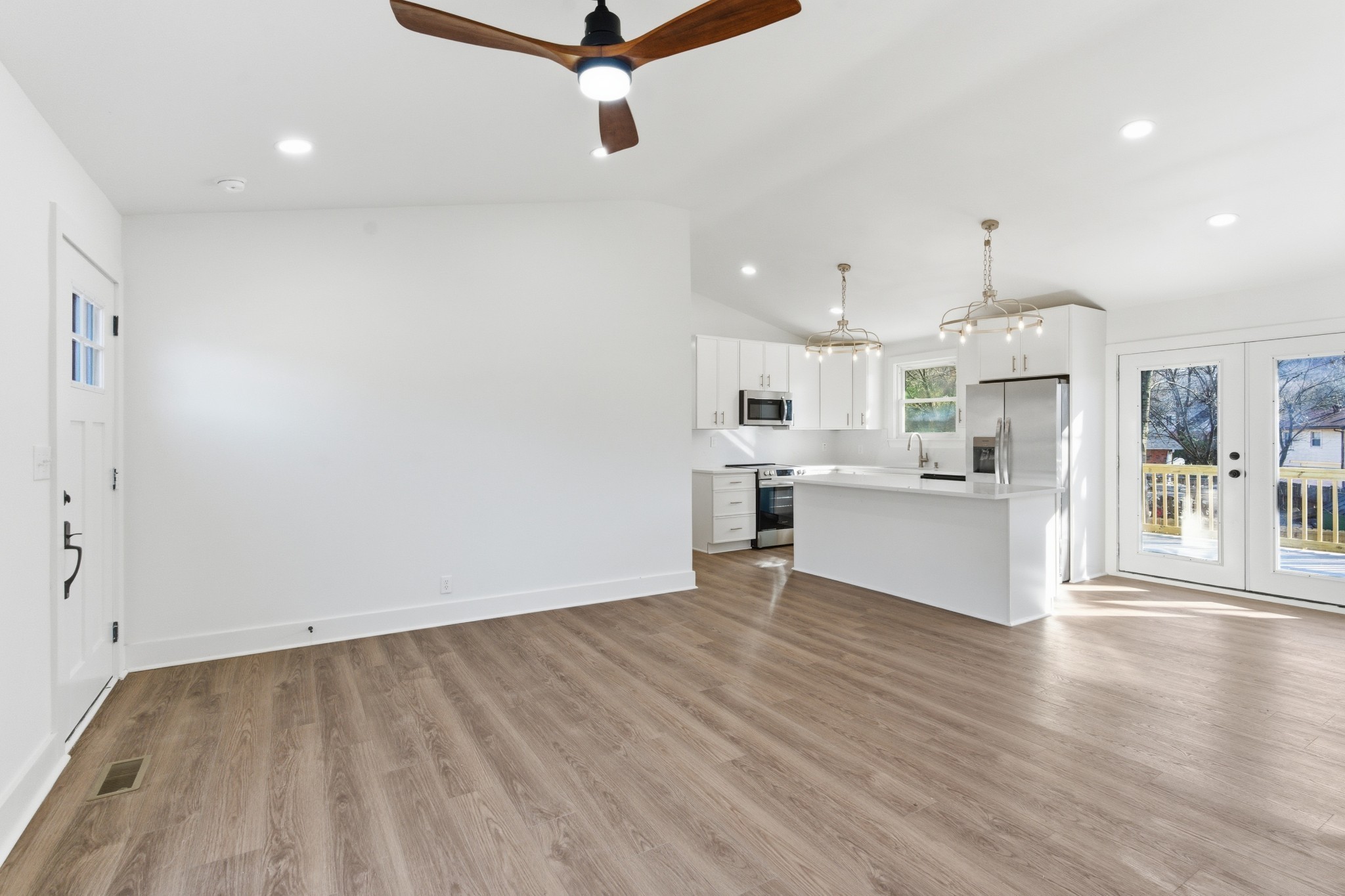 206 New Sawyer Brown Road Nashville, TN 37221 - Photo 11 of 46 a view of a kitchen with wooden floor and windows