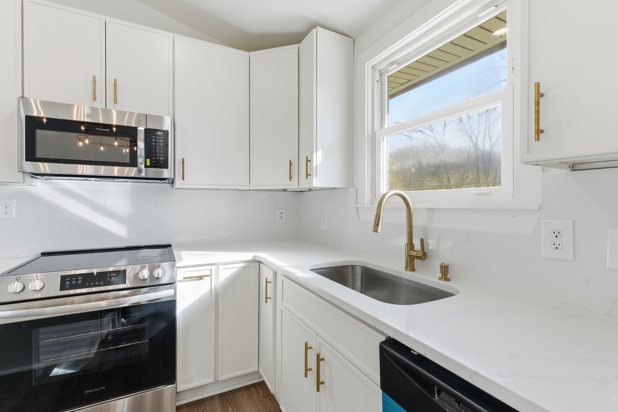 206 New Sawyer Brown Road Nashville, TN 37221 - Photo 15 of 46 a kitchen with stainless steel appliances granite countertop a sink and a stove