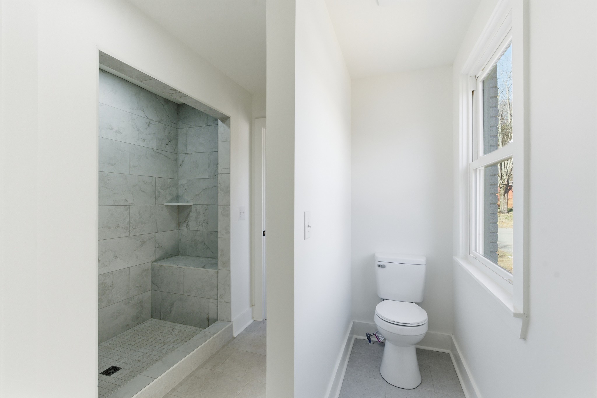 206 New Sawyer Brown Road Nashville, TN 37221 - Photo 30 of 46 a bathroom with a toilet and a shower