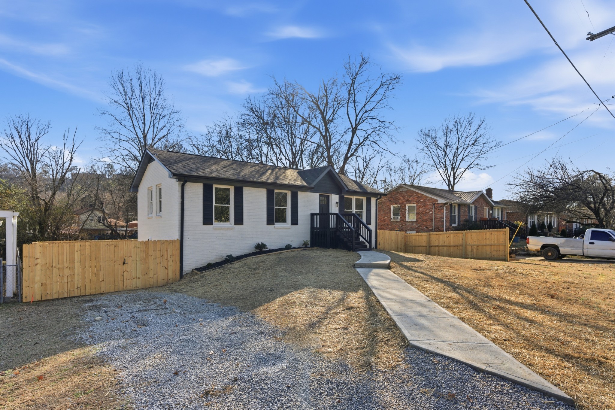 206 New Sawyer Brown Road Nashville, TN 37221 - Photo 45 of 46 a view of a house with a yard covered in snow
