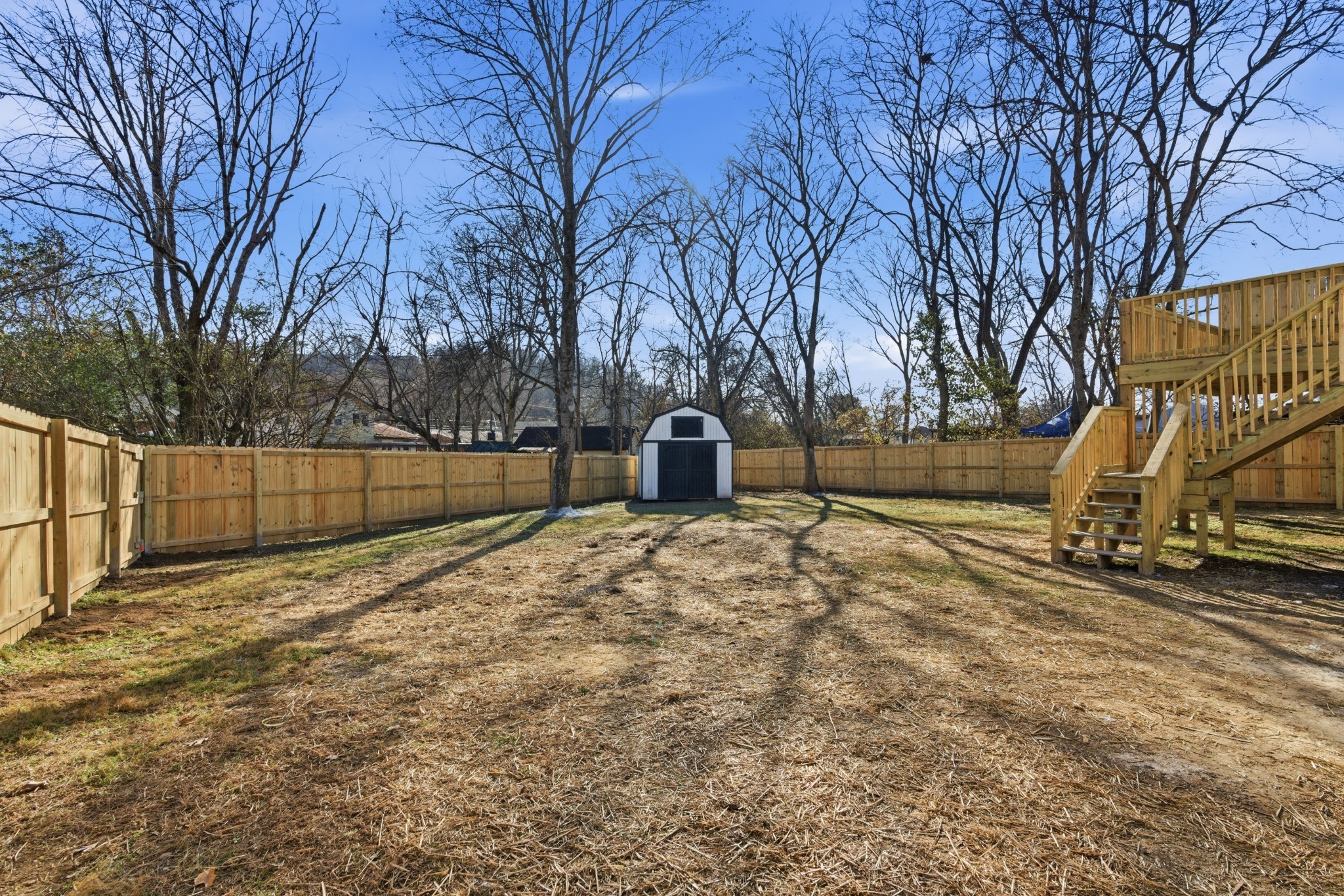 206 New Sawyer Brown Road Nashville, TN 37221 - Photo 6 of 46 a backyard of a house with a trees