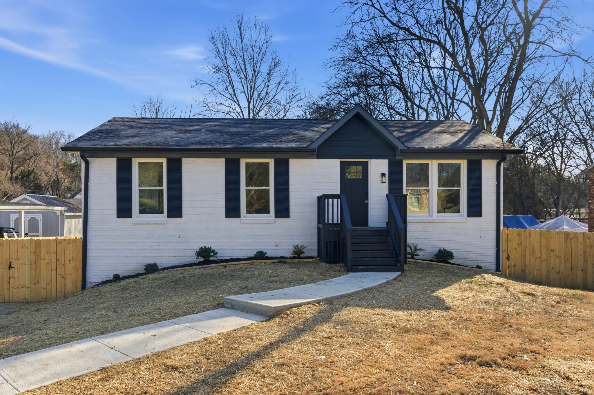 206 New Sawyer Brown Road Nashville, TN 37221 - Photo 7 of 46 a house with trees in the background