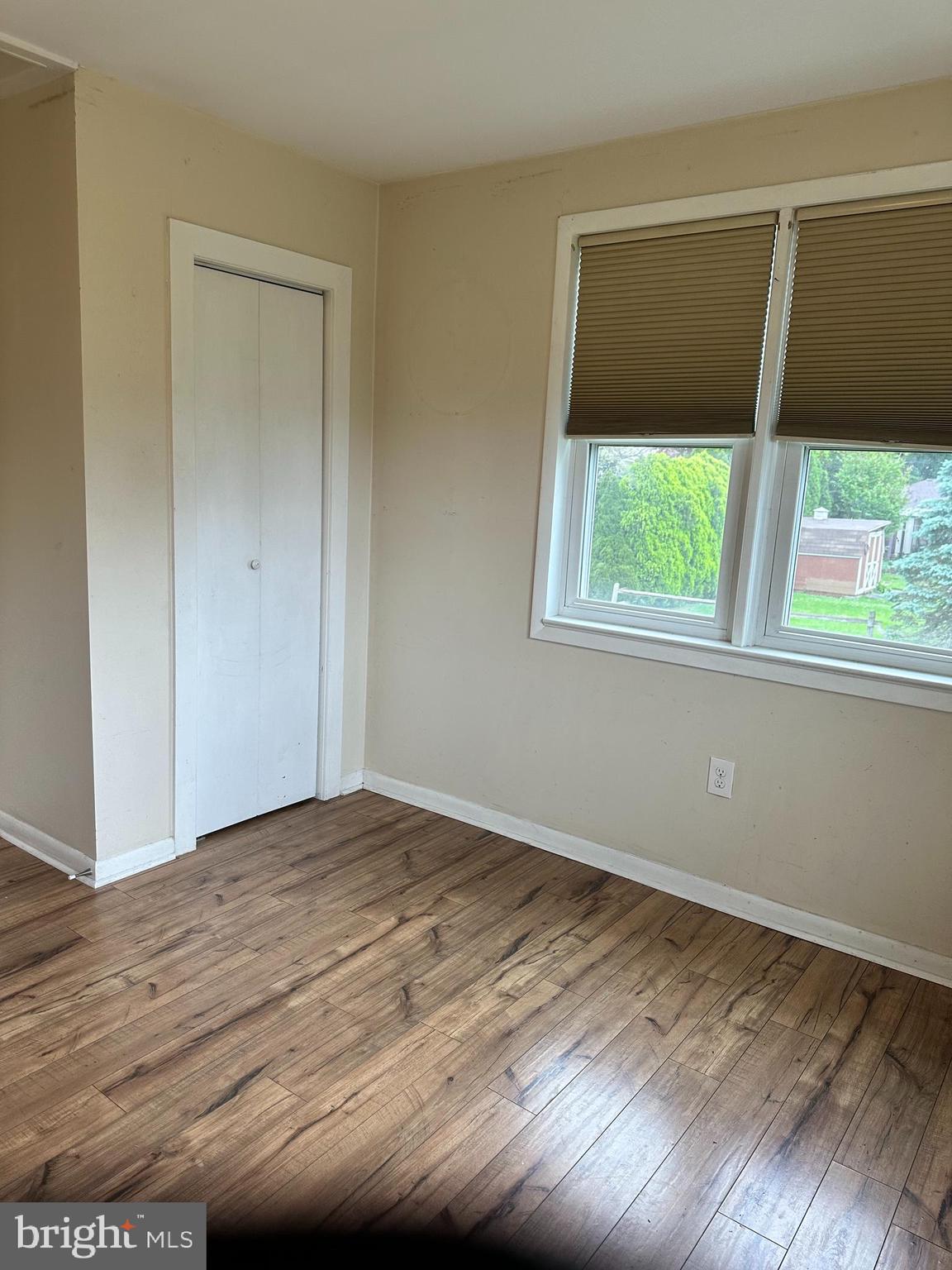 102 Myrtle Avenue Reading, PA 19606 - Photo 9 of 11 a view of an empty room with wooden floor and a window
