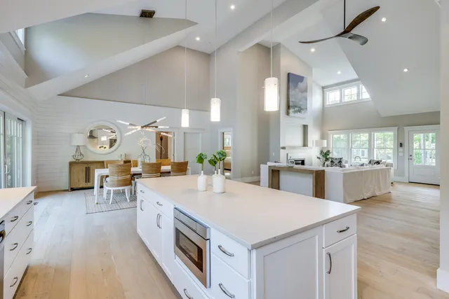 a bedroom with a large bed and a large window