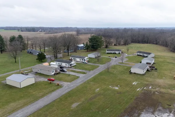 an aerial view of a house with outdoor space