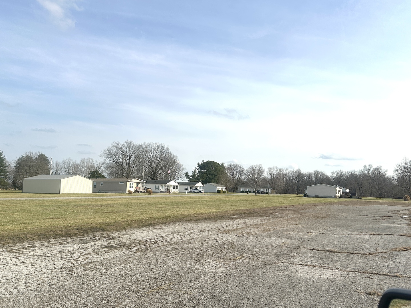 111 Devan Drive Murphysboro, IL 62966 - Photo 6 of 22 a view of a field with trees in the background