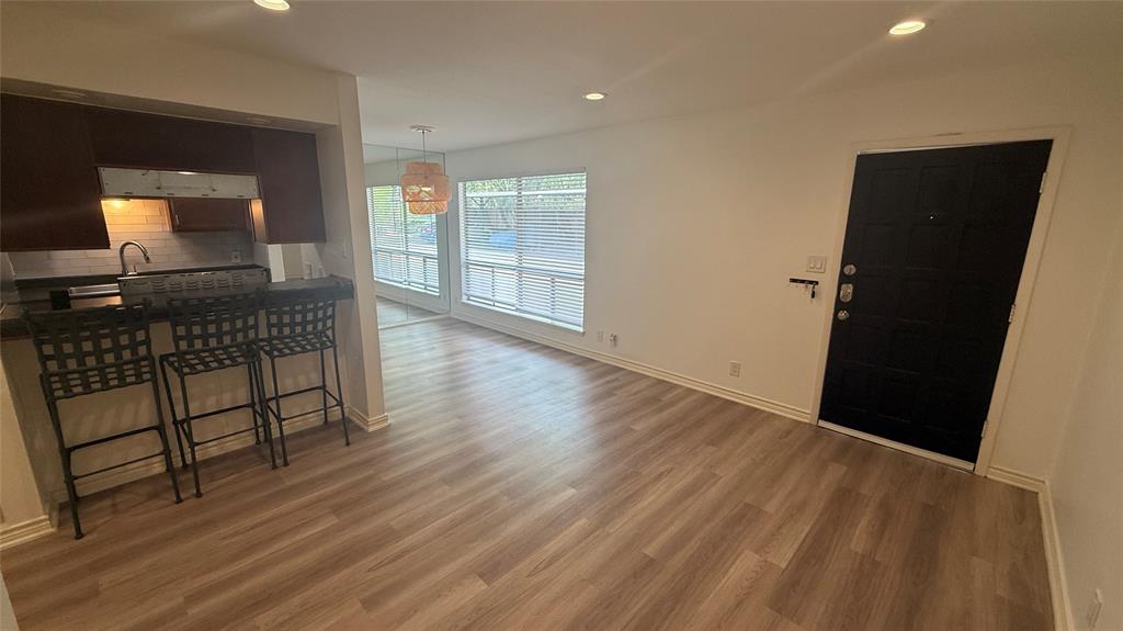 500 East Riverside Drive, Unit 132 Austin, TX 78704 - Photo 2 of 31 wooden floor in an empty room with a window