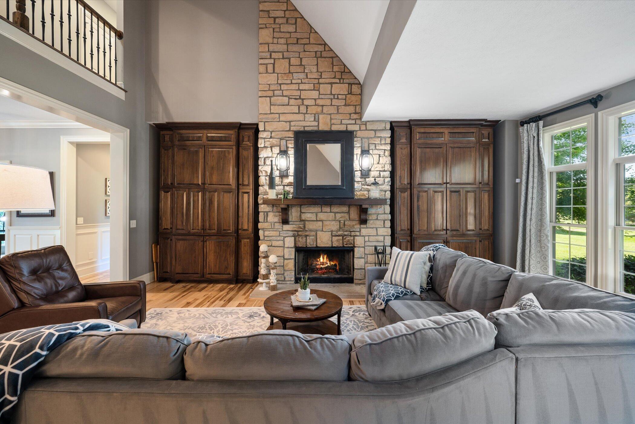 7924 Cook Road Plain City, OH 43064 - Photo 13 of 63 2-Story Stone Fireplace, Hickory Flooring, Custom Built-in Cabinets