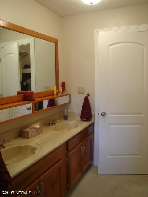 54346 Dornbush Road Callahan, FL 32011 - Photo 7 of 12 a bathroom with a sink and a mirror