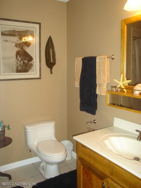 54346 Dornbush Road Callahan, FL 32011 - Photo 10 of 12 a bathroom with a toilet sink and mirror
