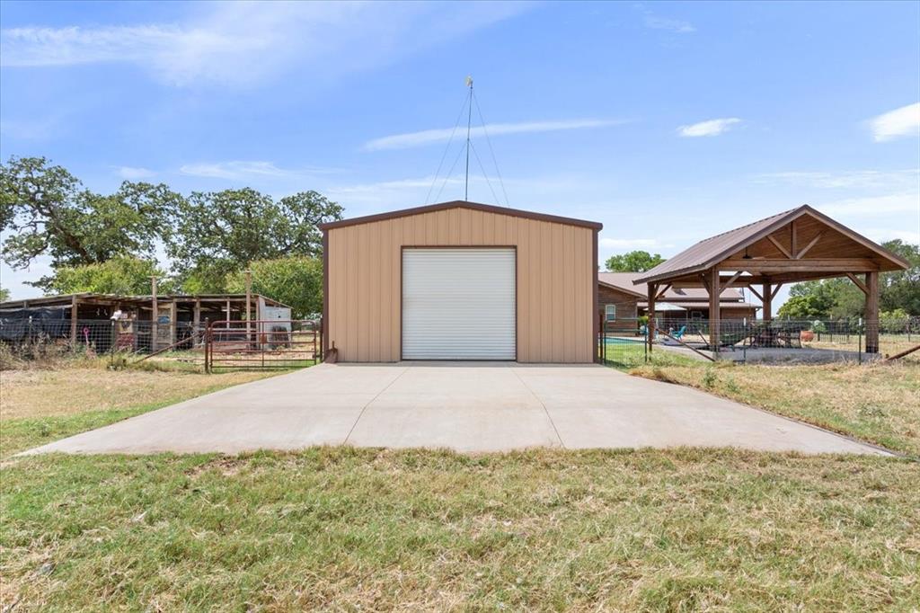 174 Ross Rd Spur Waco, TX 76705 - Photo 37 of 40 24 x 40 workshop with electricity, concrete pad at roll-up door.