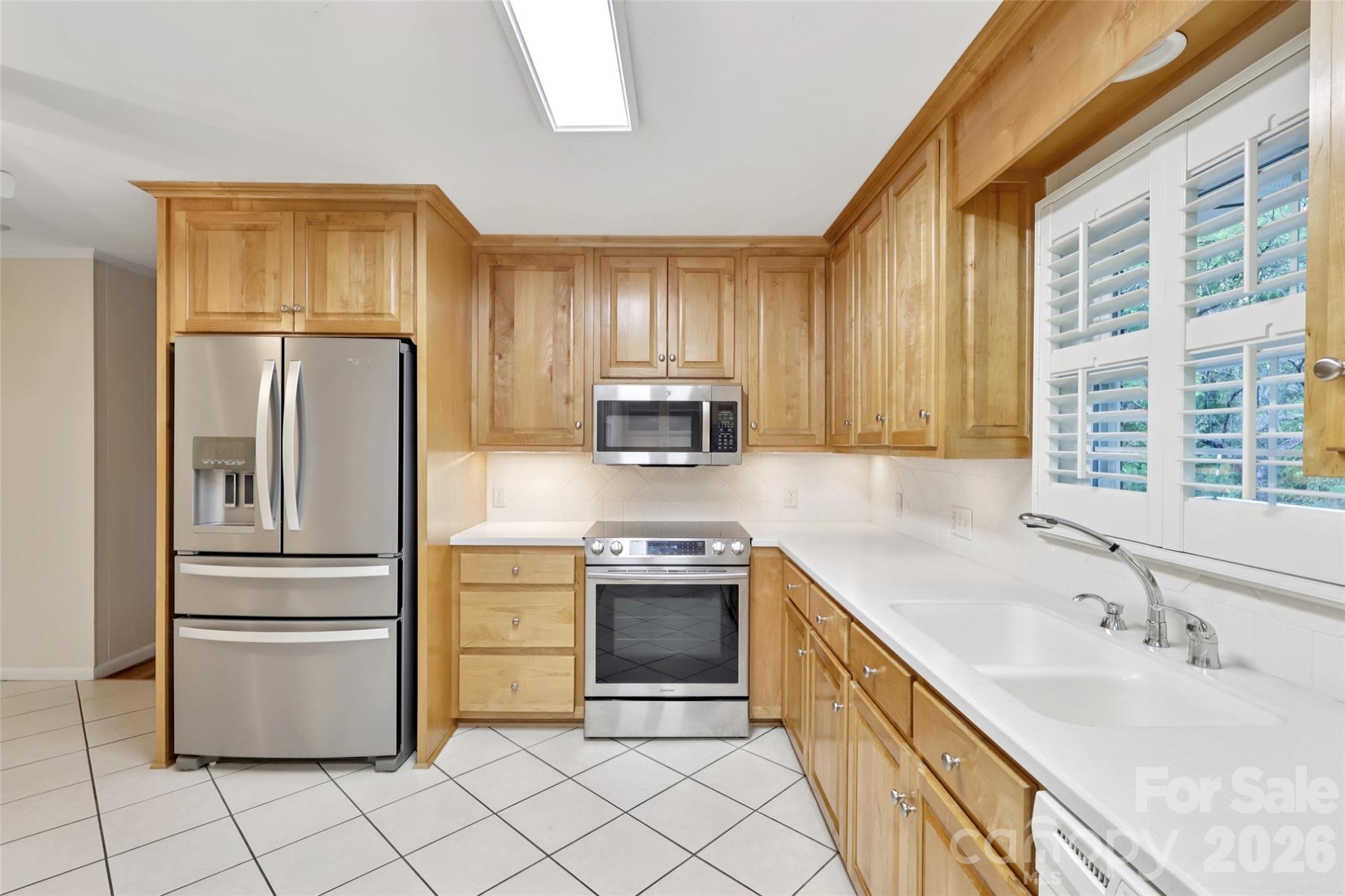 1002 Ridge Street Albemarle, NC 28001 - Photo 18 of 45 a kitchen with a sink cabinets and stainless steel appliances