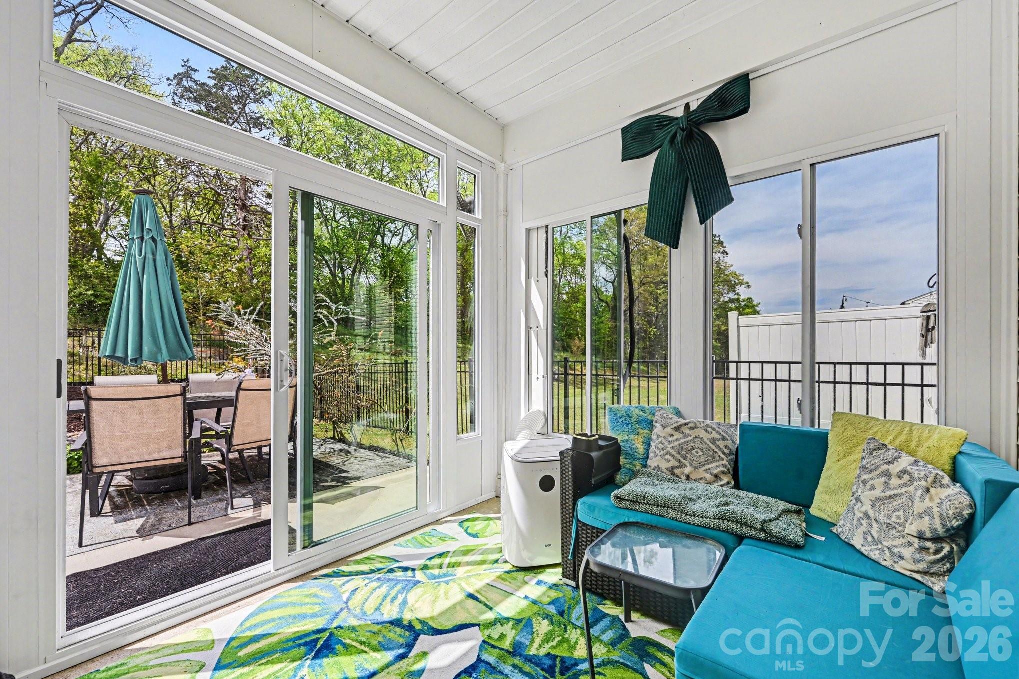 1235 Nesters Store Place Southwest Concord, NC 28027 - Photo 11 of 21 a living room with patio furniture and a floor to ceiling window
