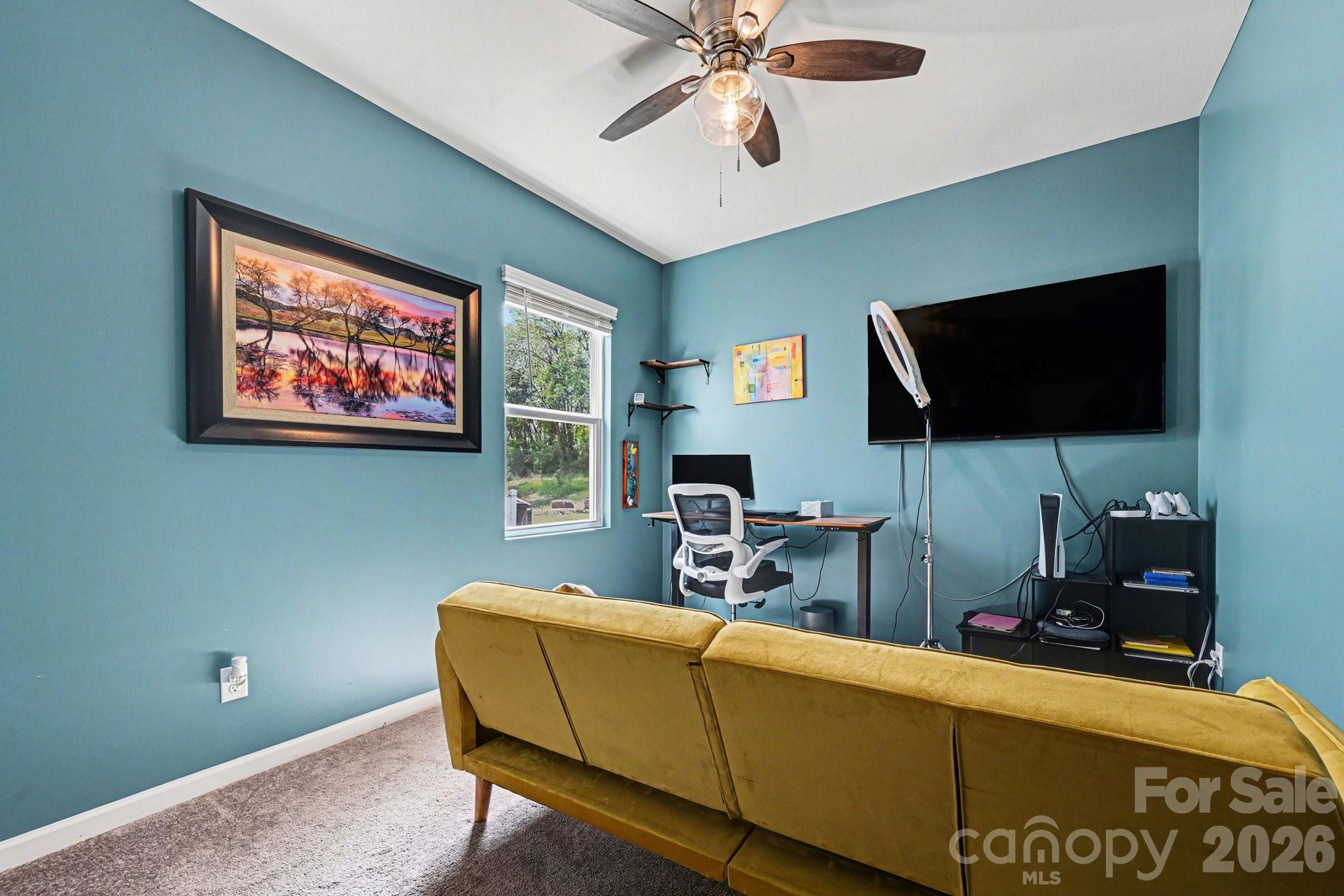 1235 Nesters Store Place Southwest Concord, NC 28027 - Photo 16 of 21 a living room with furniture and a flat screen tv