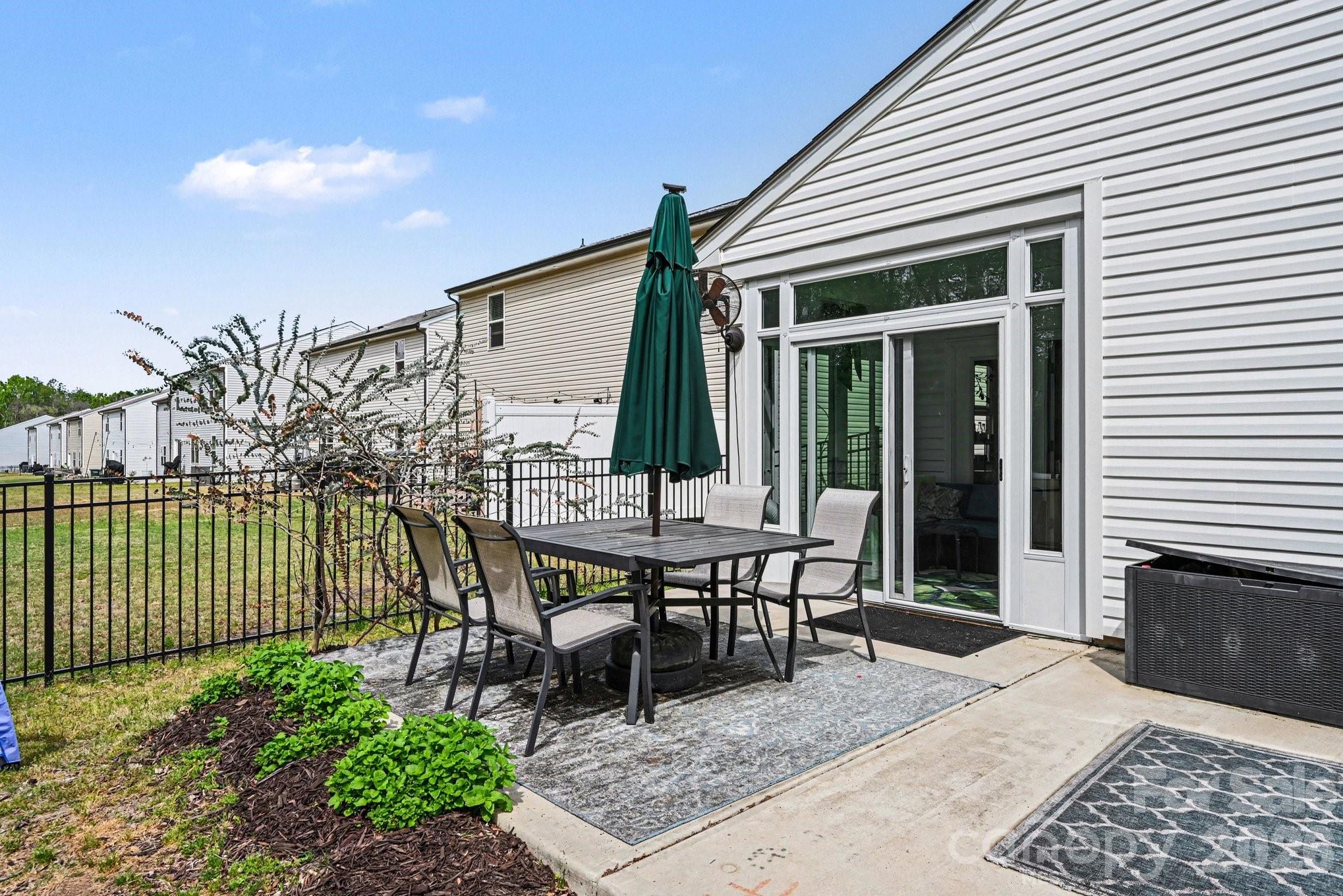 1235 Nesters Store Place Southwest Concord, NC 28027 - Photo 19 of 21 a view of a patio with table and chairs and potted plants