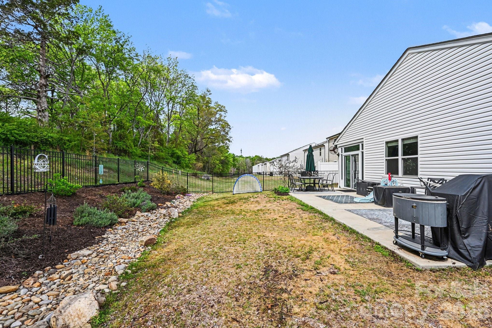 1235 Nesters Store Place Southwest Concord, NC 28027 - Photo 21 of 21 a view of a backyard with sitting area