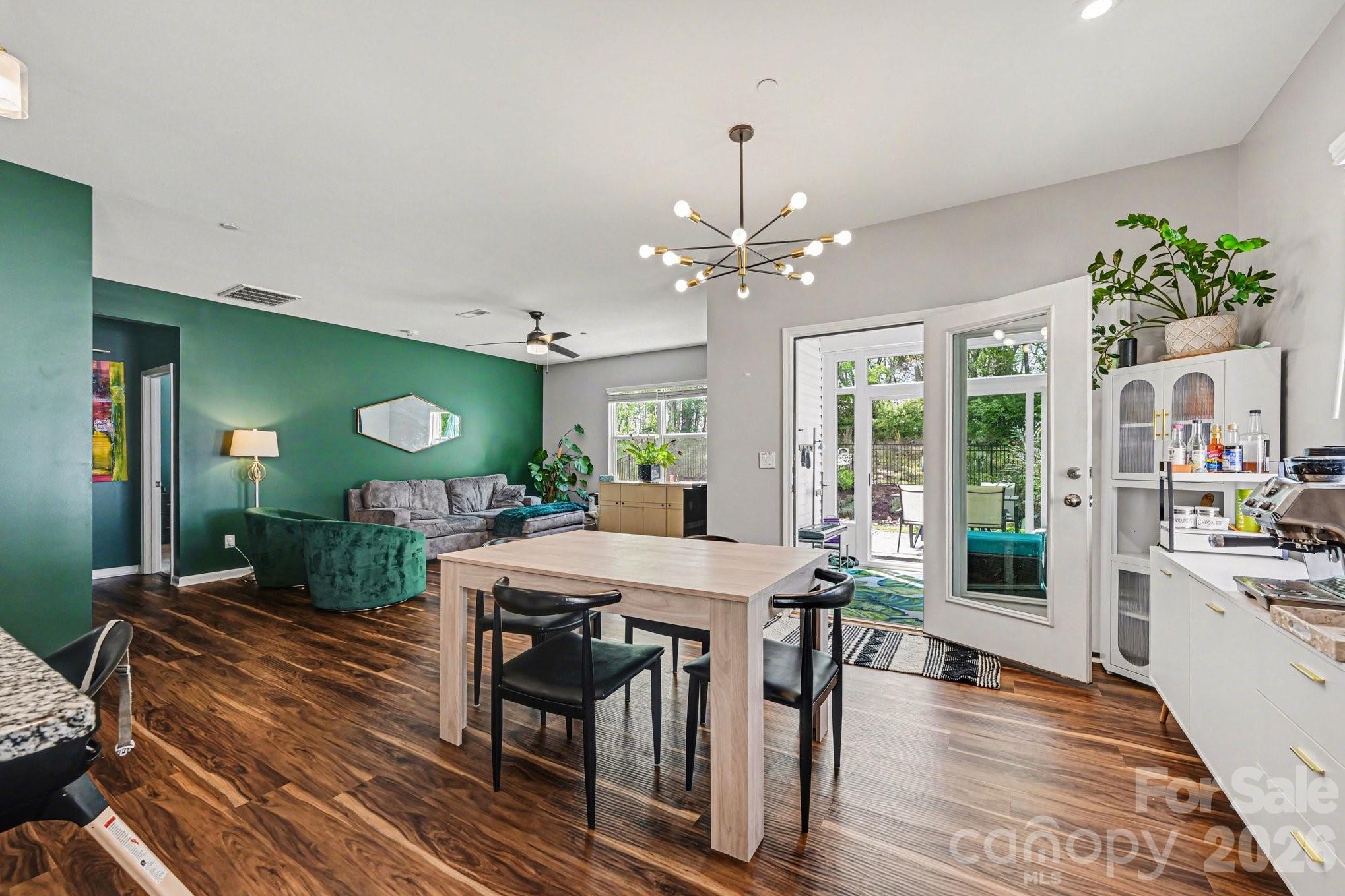 1235 Nesters Store Place Southwest Concord, NC 28027 - Photo 8 of 21 a view of a dining room with furniture window and wooden floor