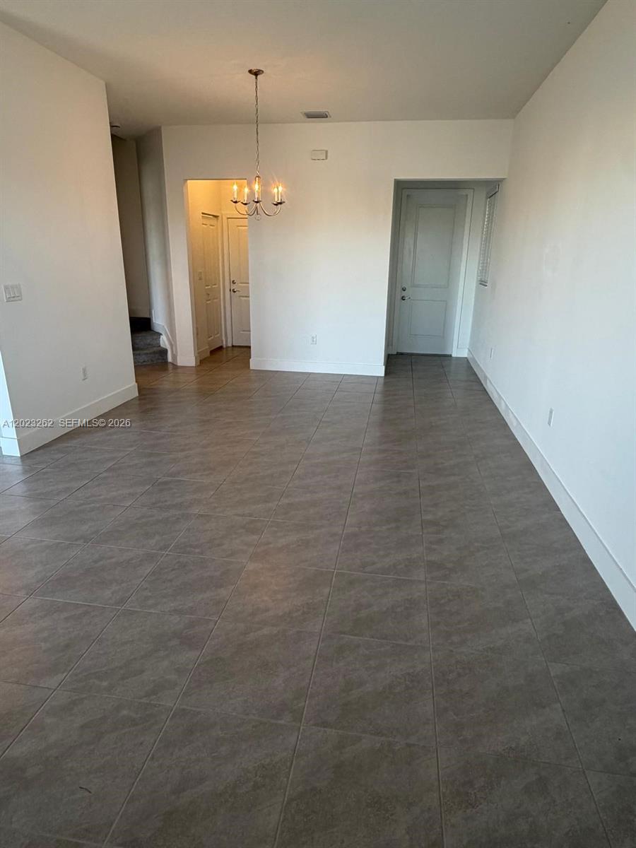 5669 Cerva Lane, Unit 5669 Immokalee, FL 34142 - Photo 27 of 32 a view of a livingroom with a staircase