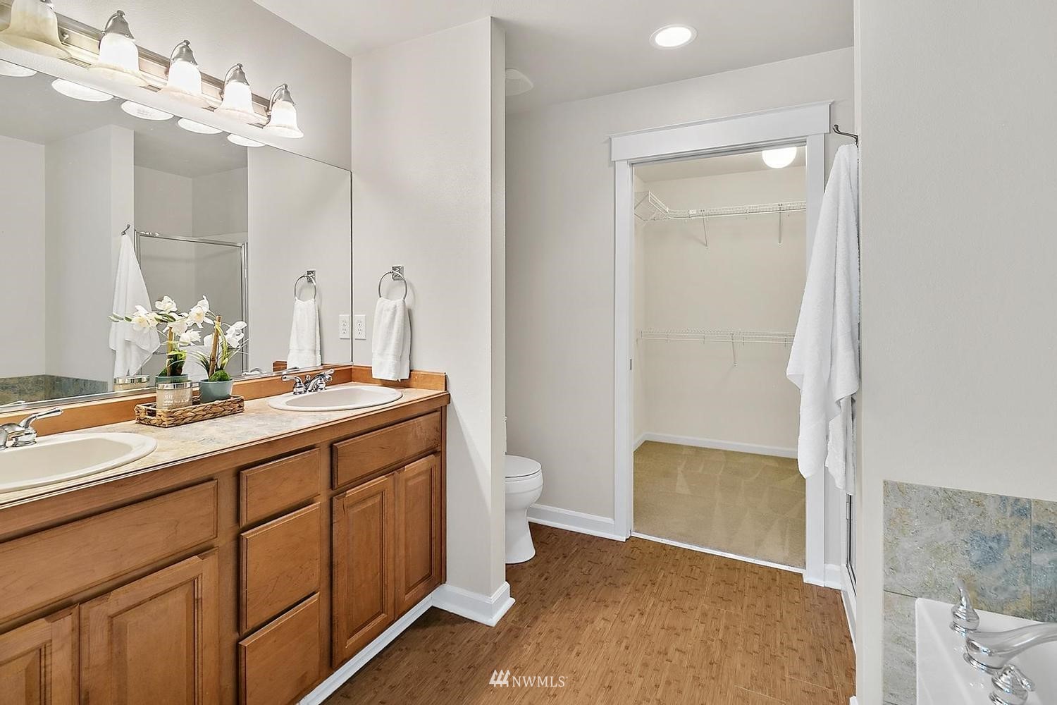 91 East Soderberg Road, Unit E14 Allyn, WA 98524 - Photo 18 of 40 a bathroom with a granite countertop sink a toilet and a mirror