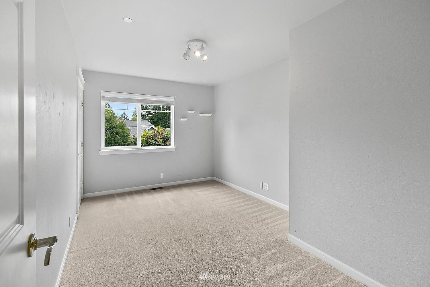 91 East Soderberg Road, Unit E14 Allyn, WA 98524 - Photo 27 of 40 an empty room with windows