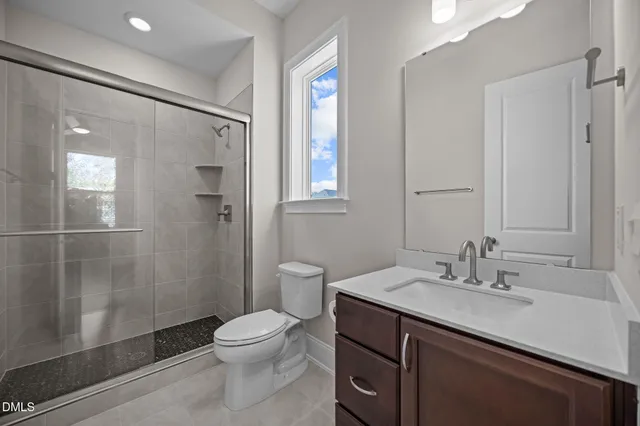 a view of a kitchen with a sink and a large window