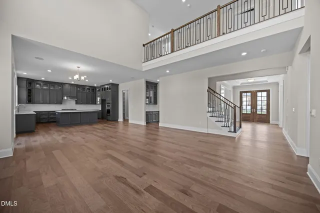 a kitchen with stainless steel appliances granite countertop a sink and a refrigerator