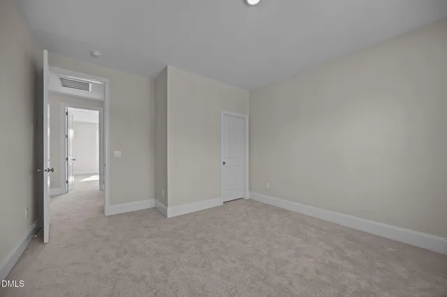 a bathroom with a granite countertop sink a toilet a mirror a bathtub and shower