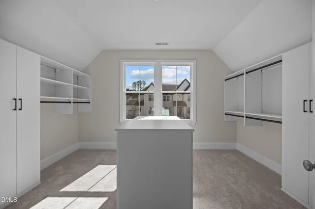 a view of a brick house with a large windows