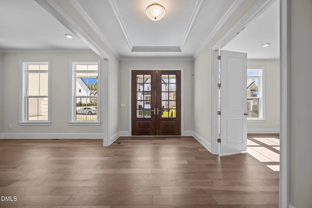 a view of a big room with wooden floor and a bathroom