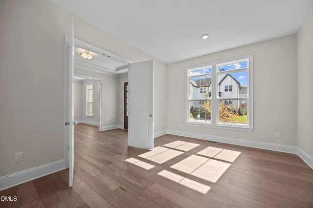 a view of livingroom with window hardwood floor and ceiling fan
