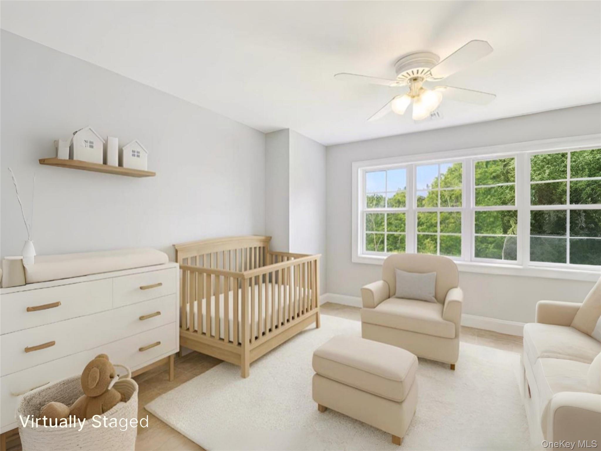 12 Laila Lane Remsenburg, NY 11960 - Photo 28 of 50 a bedroom with furniture and a window