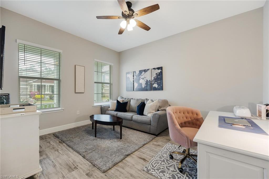 3621 Pilot Circle Naples, FL 34120 - Photo 12 of 46 a living room with furniture and a window