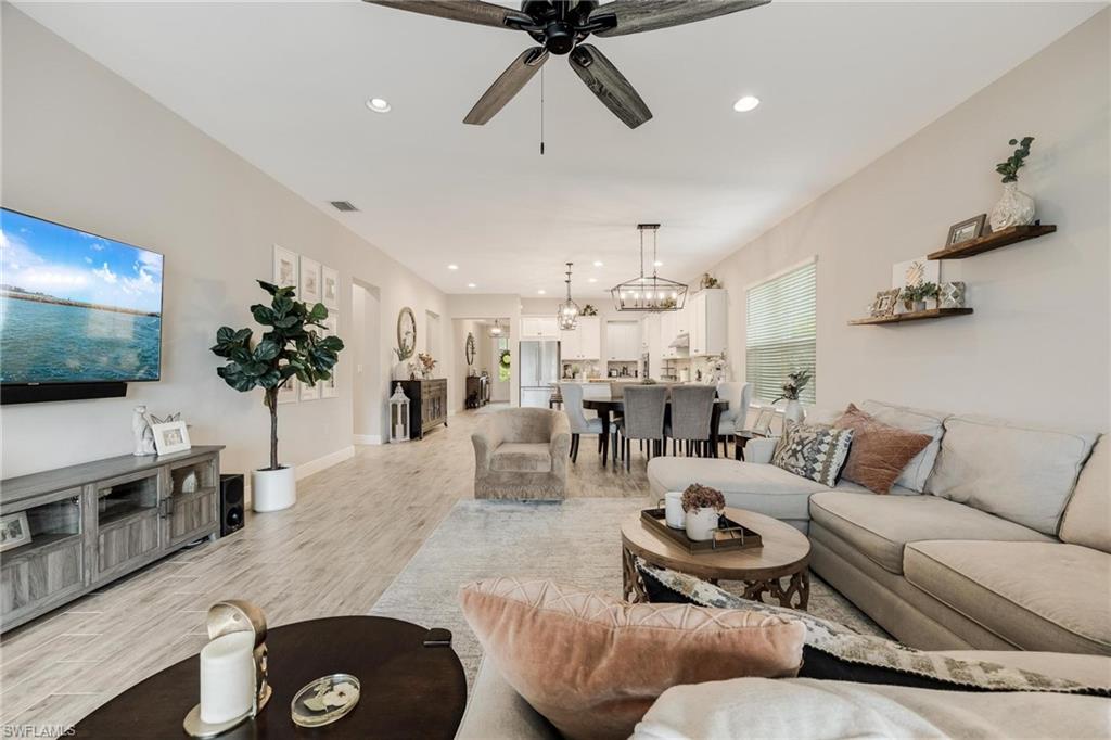 3621 Pilot Circle Naples, FL 34120 - Photo 13 of 46 a living room with furniture and a flat screen tv