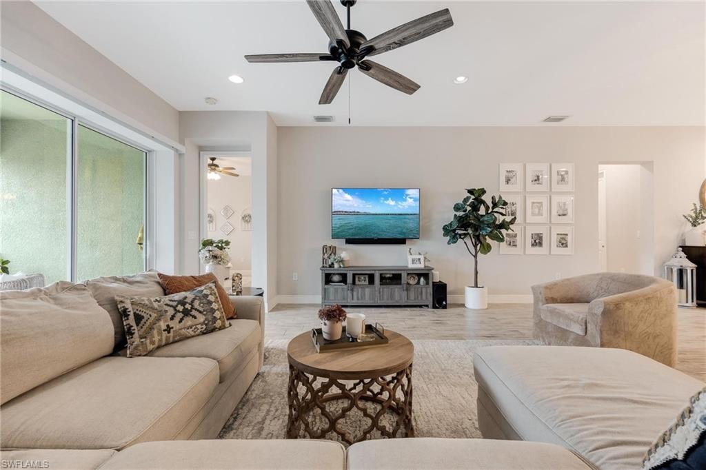 3621 Pilot Circle Naples, FL 34120 - Photo 14 of 46 a living room with furniture and a flat screen tv