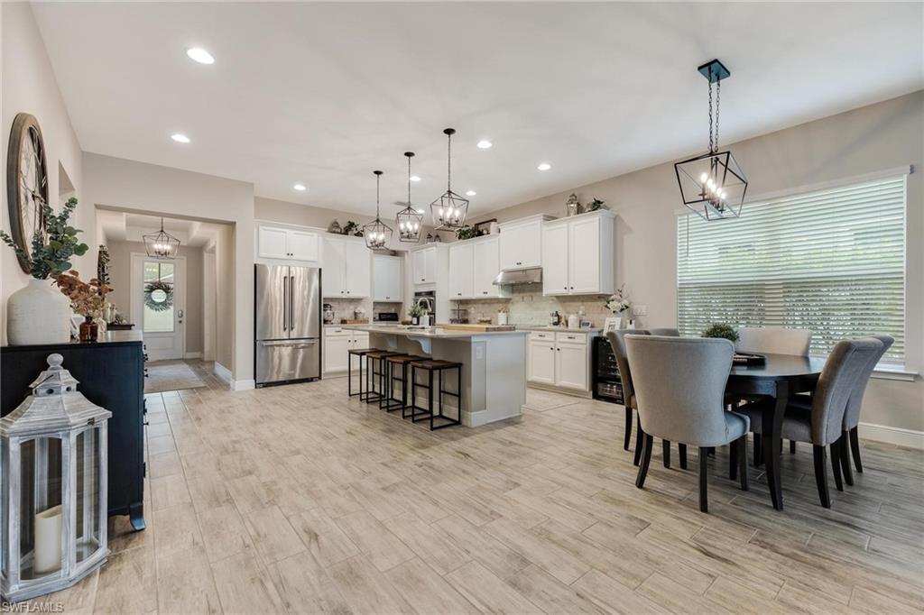 3621 Pilot Circle Naples, FL 34120 - Photo 18 of 46 a large kitchen with a table and chairs