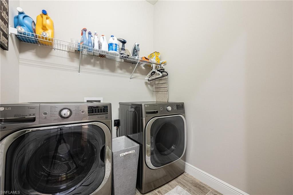 3621 Pilot Circle Naples, FL 34120 - Photo 32 of 46 a utility room with dryer and washer