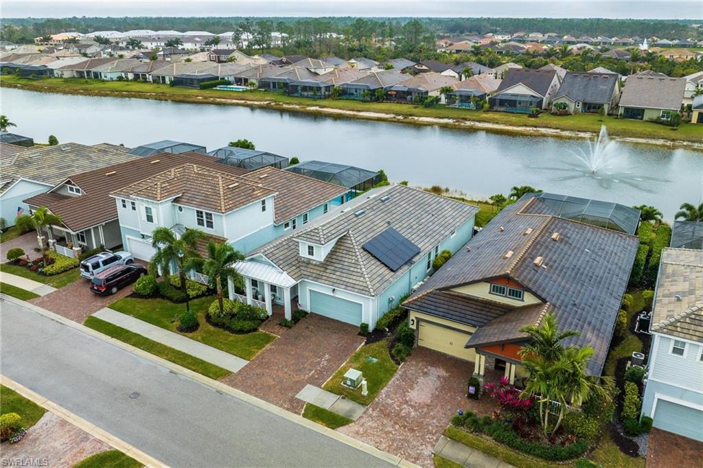 3621 Pilot Circle Naples, FL 34120 - Photo 35 of 46 an aerial view of residential houses with outdoor space and ocean view