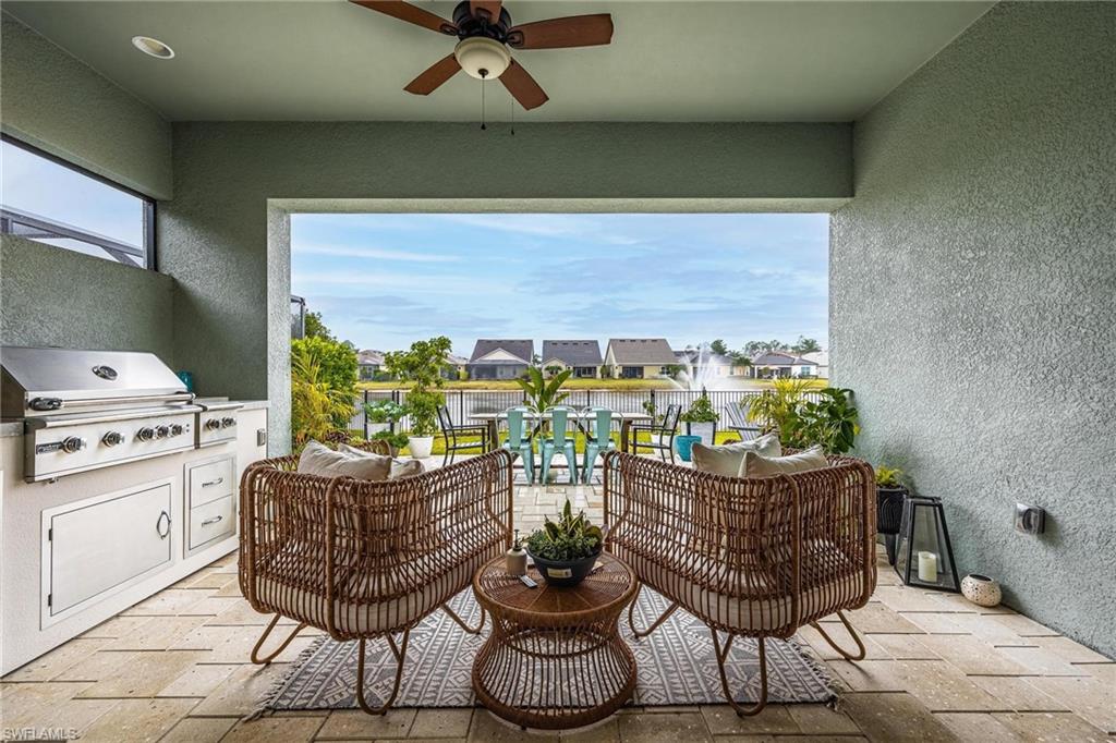 3621 Pilot Circle Naples, FL 34120 - Photo 40 of 46 a dining room with furniture and a potted plant
