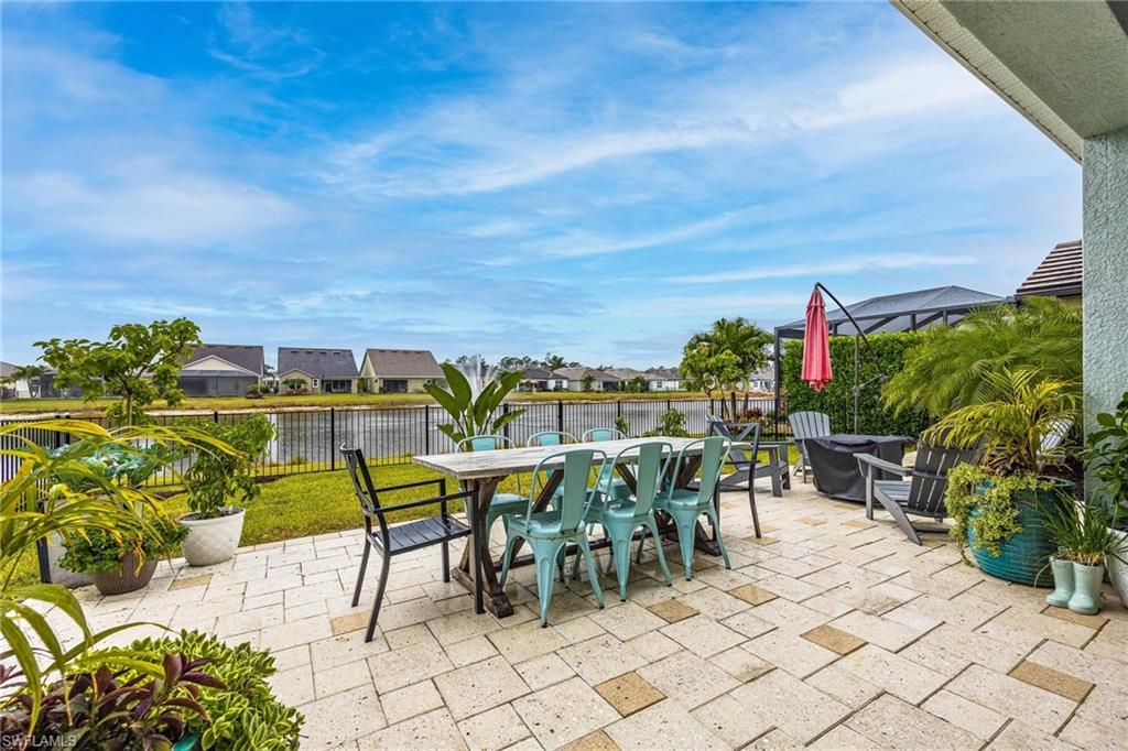 3621 Pilot Circle Naples, FL 34120 - Photo 42 of 46 a view of a tables and chairs in patio