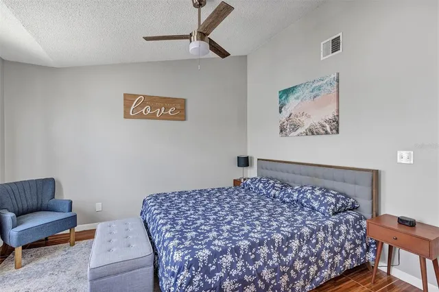 a bedroom with bed and a couch