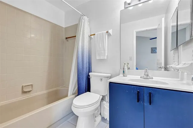 a bathroom with a sink a toilet and a bathtub