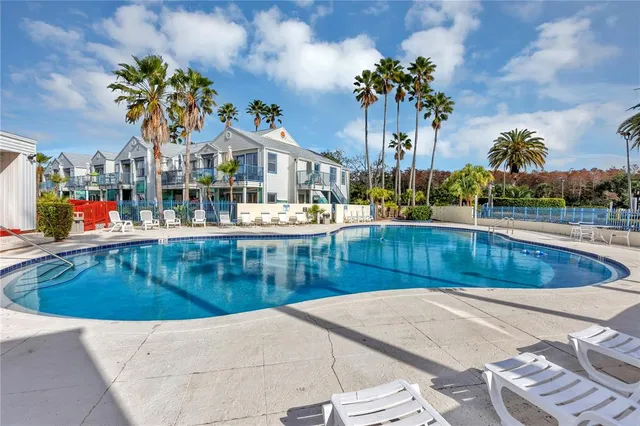 a room with gym equipment and windows