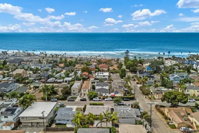 a backyard of a house with lots of green space and fountain
