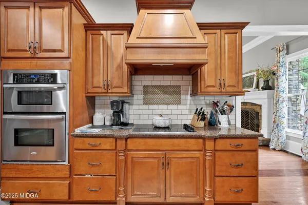 a spacious bathroom with a granite countertop sink a mirror and a