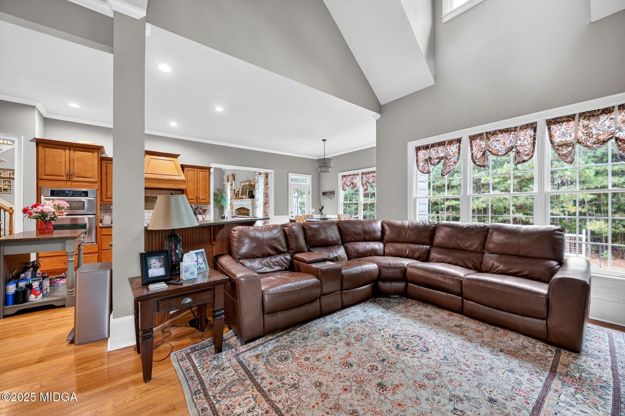 120 Homestead Circle Forsyth, GA 31029 - Photo 17 of 68 a living room with furniture and a large window
