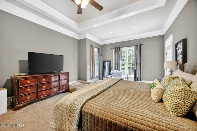 a bed room with a bed and a couch