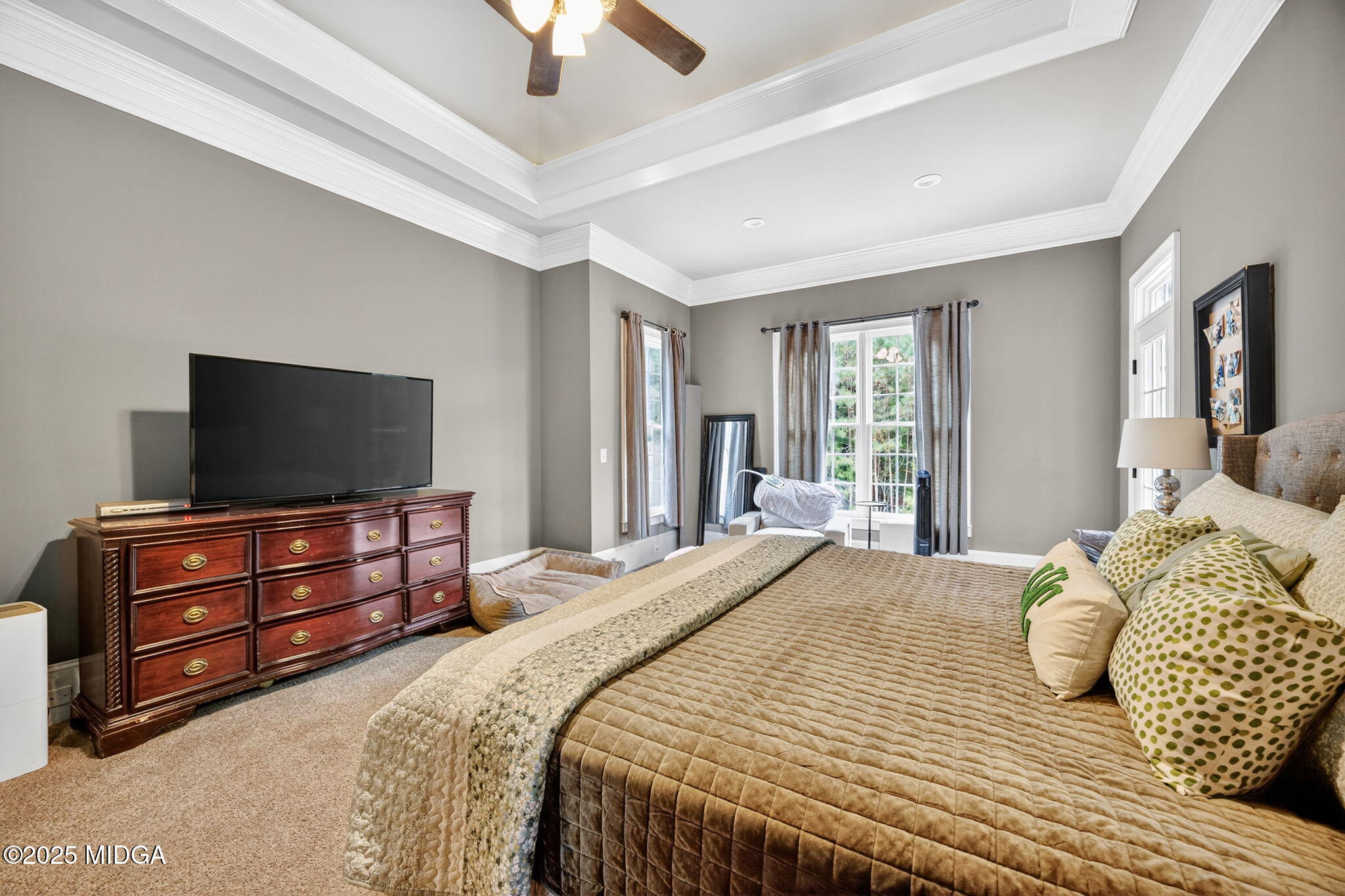 120 Homestead Circle Forsyth, GA 31029 - Photo 18 of 68 a bedroom with a bed and a flat screen tv