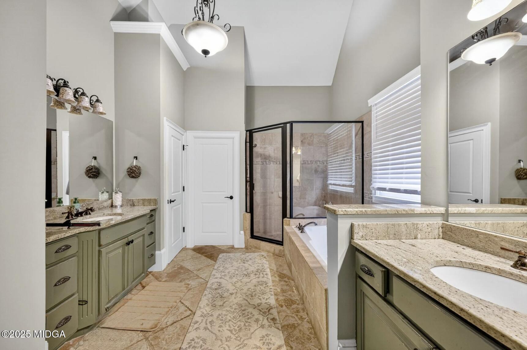 120 Homestead Circle Forsyth, GA 31029 - Photo 20 of 68 a spacious bathroom with a granite countertop sink a mirror and a